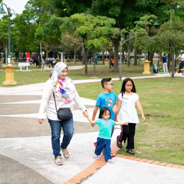 malaysian family walking in the park