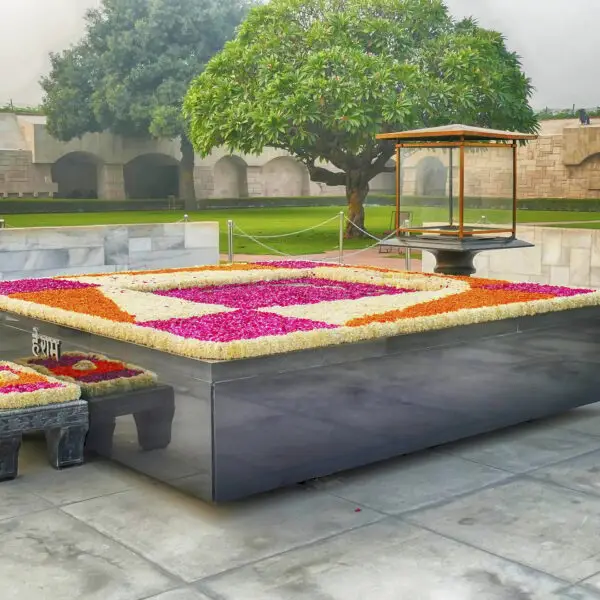 Raj Ghat memorial surrounded by a garden under the sunlight in Delhi, India