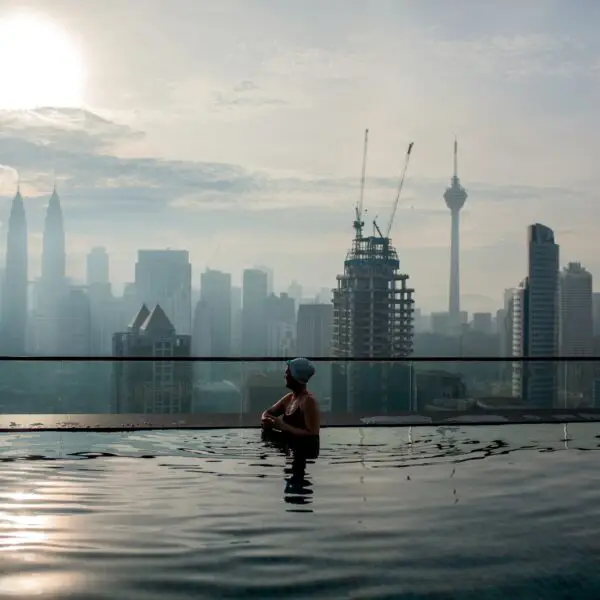 Relaxing in pool and enjoying city panorama. Kuala Lumpur, Malaysia
